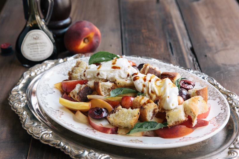 A dreamy summer fruit salad topped with creamy burrata cheese • theVintageMixer.com 