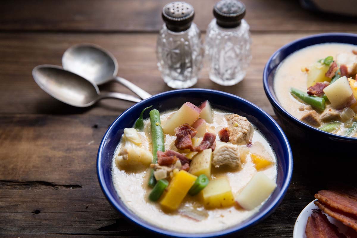 Chicken Corn Chowder Recipe loaded with veggies and a creamy broth • theVintageMixer.com #soup #chowder