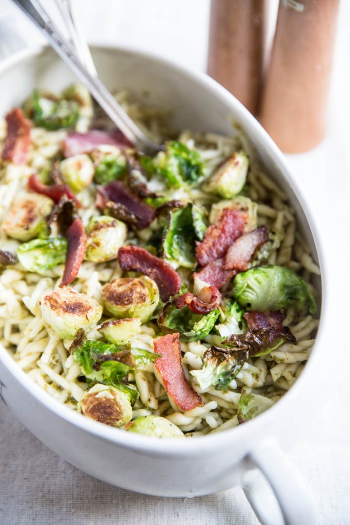 Pesto Trofie Pasta with Brussels Sprout Chips and Bacon • theVintageMixer.com #pasta #brusselssprouts #bacon #eatseasonal