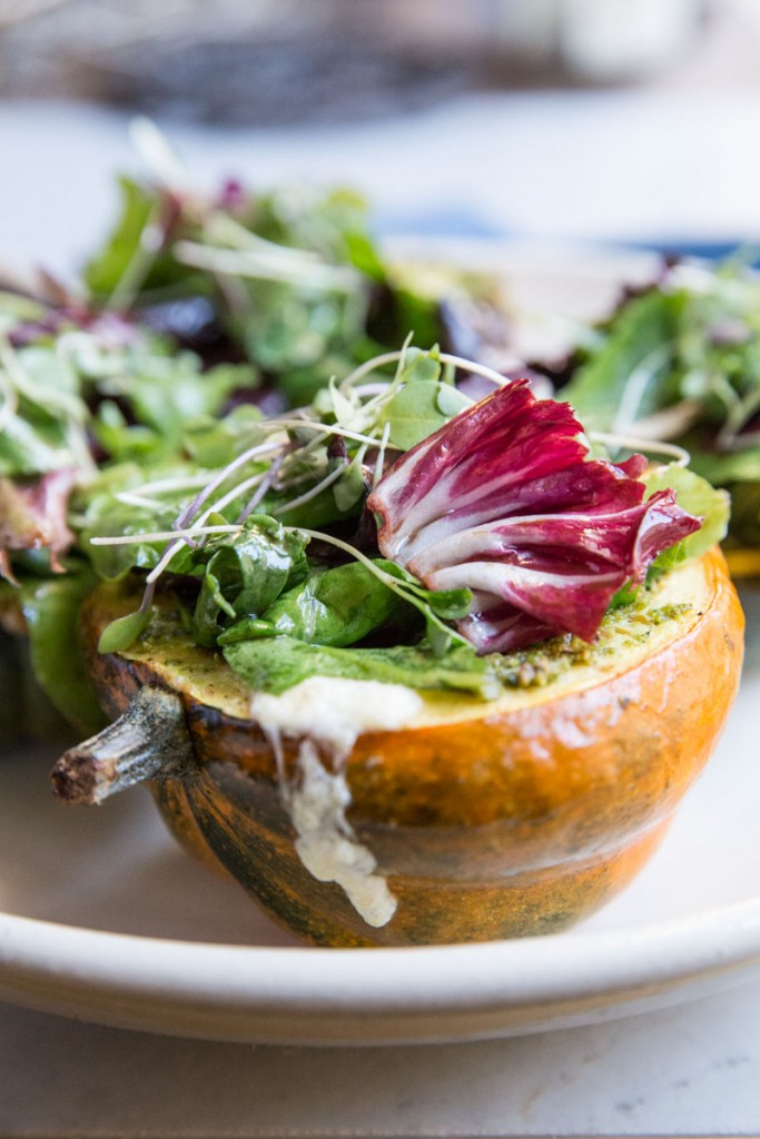 Stuffed Acorn Squash with Burrata Pesto and Greens • theVintageMixer.com #acornsquash #buratta #sidedishrecipe