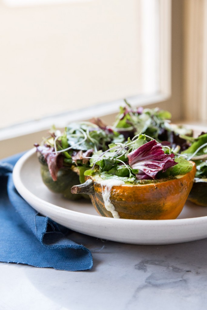 Stuffed Acorn Squash with Burrata Pesto and Greens • theVintageMixer.com #acornsquash #buratta #sidedishrecipe