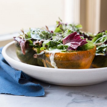 Stuffed Acorn Squash with Burrata Pesto and Greens • theVintageMixer.com #acornsquash #buratta #sidedishrecipe