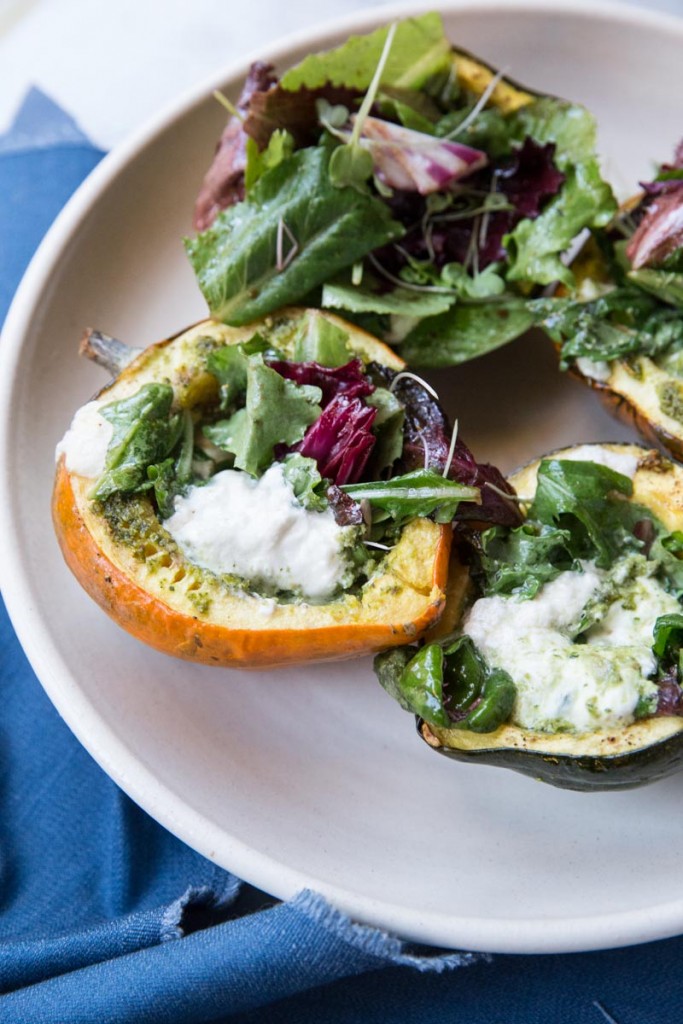 Stuffed Acorn Squash with Burrata Pesto and Greens • theVintageMixer.com #acornsquash #buratta #sidedishrecipe