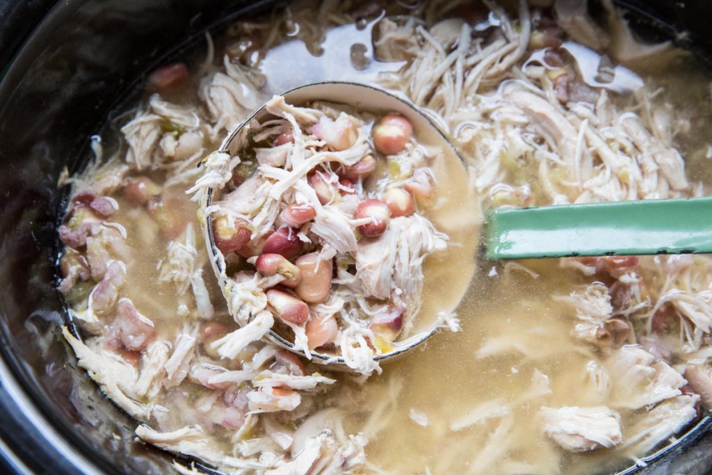 Slow Cooker Green Chile Chicken Posole Recipe • theVintageMixer.com #posole #slowcookerrecipe #slowcookersouprecipe #bonebroth #healthyrecipe