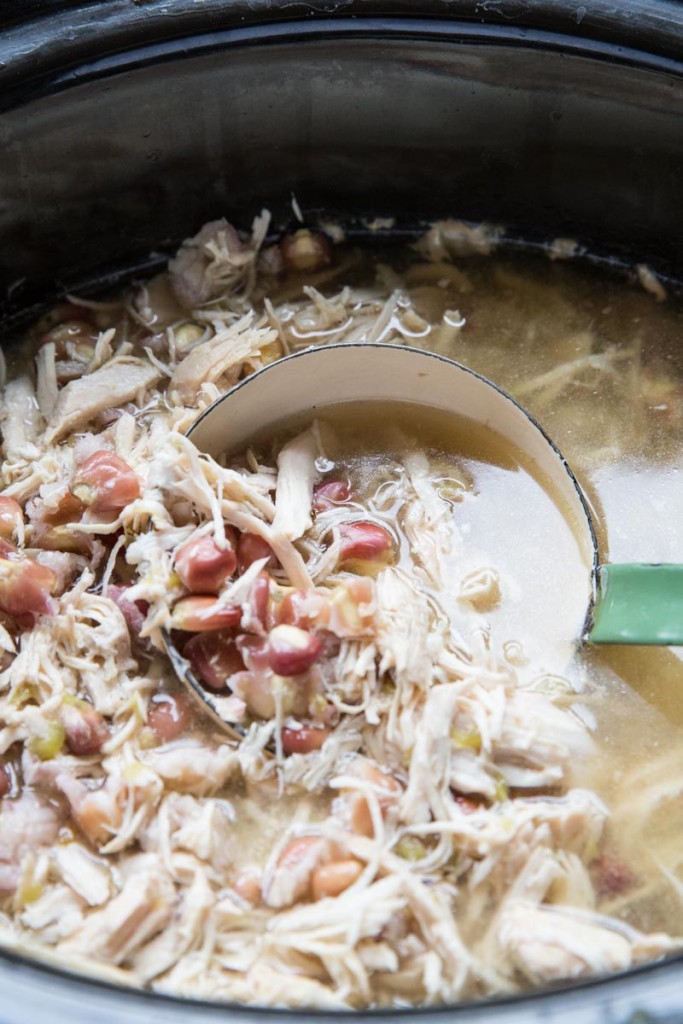 Slow Cooker Green Chile Chicken Posole Recipe • theVintageMixer.com #posole #slowcookerrecipe #slowcookersouprecipe #bonebroth #healthyrecipe