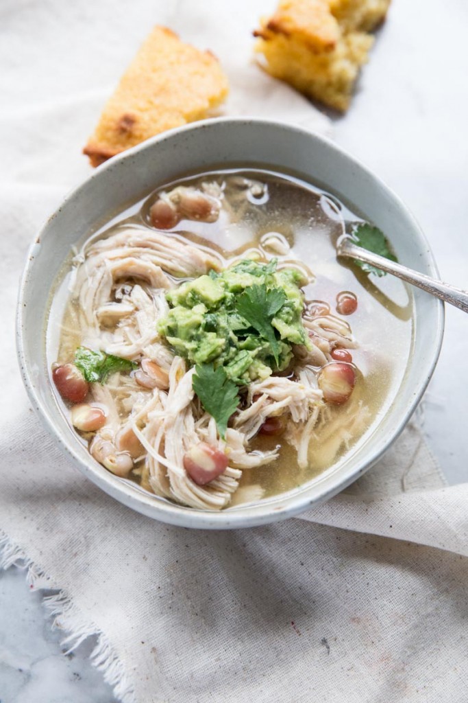 Slow Cooker Green Chile Chicken Posole Recipe • theVintageMixer.com #posole #slowcookerrecipe #slowcookersouprecipe #bonebroth #healthyrecipe