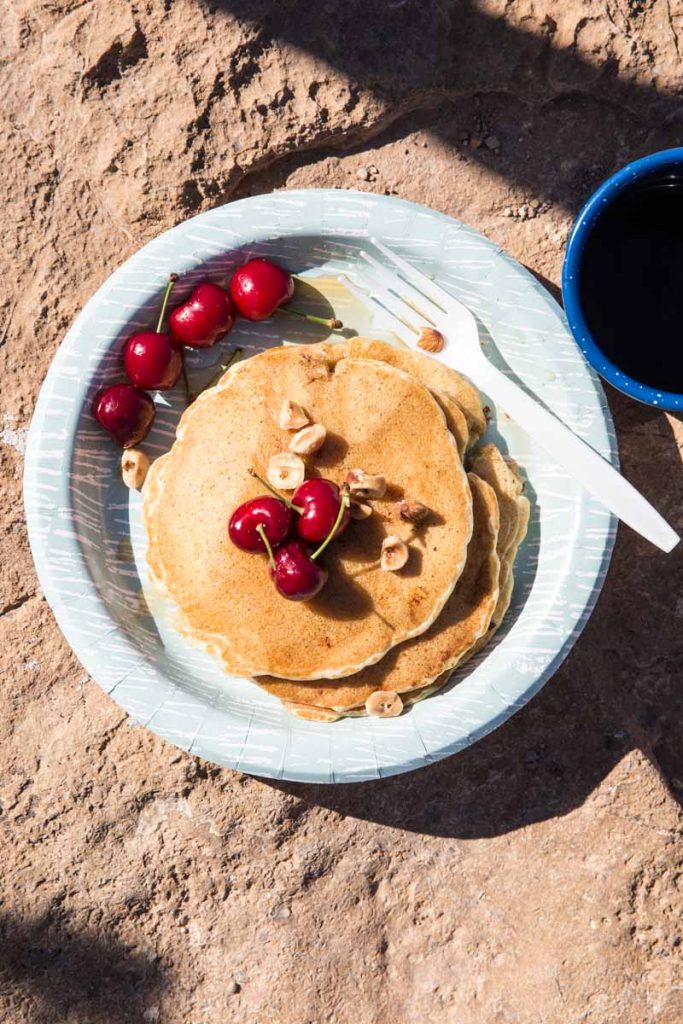 These hearty pancakes loaded with oats, fruit, and nuts, are perfect to fuel any camping adventure 