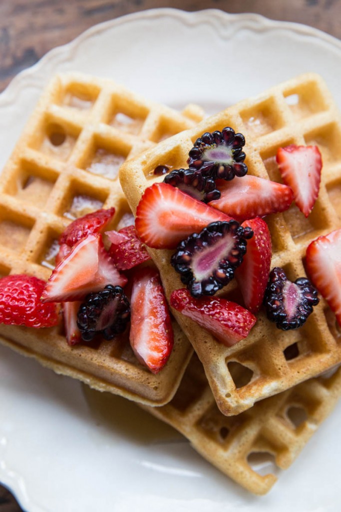 Simple Whole Wheat Waffles served with fresh berries and pure maple syrup