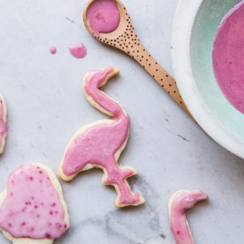 How cute are these flamingo and ice cream cone cut out cookies. This is a fail proof cut out cookie recipe and a delicious icing made with all natural flavors and food coloring.