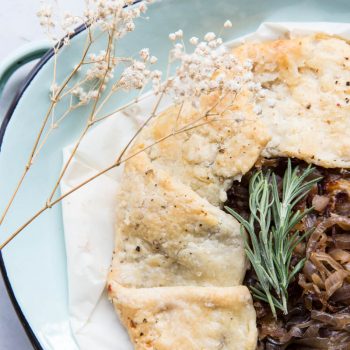 This savory Caramelized Onion Galette makes for a perfect appetizer or summer meal alongside a green salad.