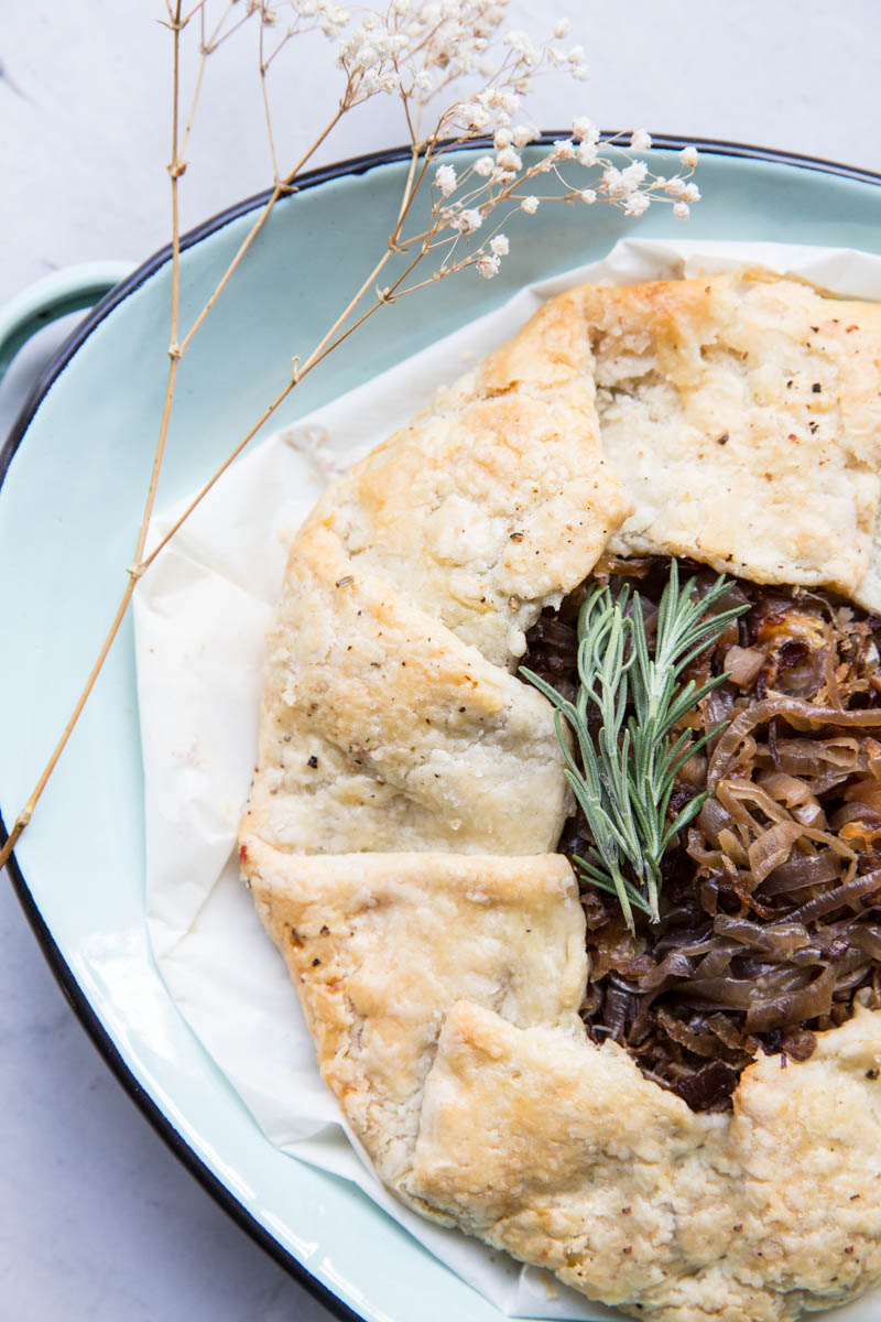 This savory tart or galette filled with caramelized onions is a great party appetizer. 