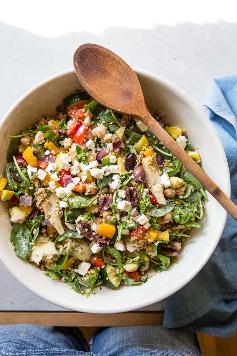 This Mediterranean Quinoa Salad Recipe makes a giant bowl perfect for make ahead weekday lunches or a big party side dish.