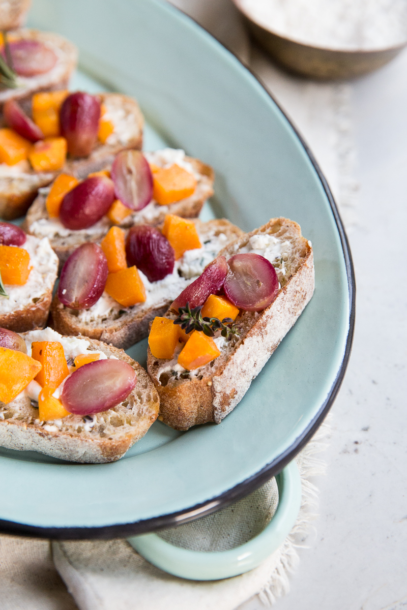 Roasted butternut squash and grapes are the perfect topping for crostini. 