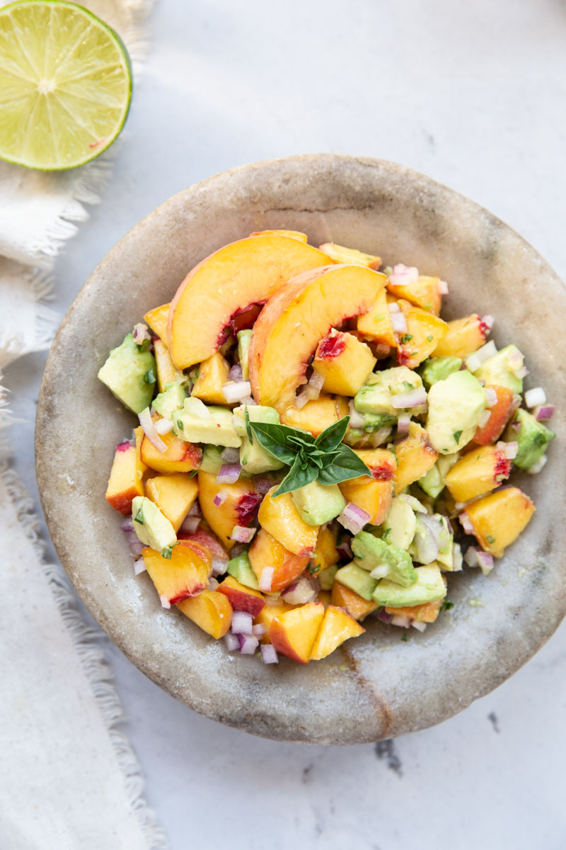 We love this peach and avocado salsa on tacos or rice and chicken bowls. 